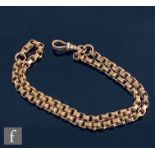 An early 20th Century 9ct rose gold double belcher link bracelet terminating in swivel clasp, weight