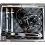 A cased set of SE Electronics SE5 microphones, sE5 Factory-Matched Stereo Pair, together with