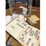 Assorted albums of world stamps, part stock sheets, loose stamps and an album of cigarette cards and