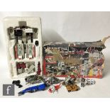 A collection of Habsro Transformers G1 to include Metroplex in partial box, three Dinobots, Dirge,