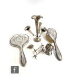 Six items of hallmarked silver to include a pedestal pin cushion, a pair of knife rests, a sovereign