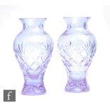 A pair of later 20th Century Caithness glass vases, each of baluster form with everted collar
