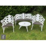 A 20th Century cast alloy suite of garden furniture in the style of Coalbrookdale's Blackberry and