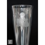 An 18th Century drinking glass, the over sized tall funnel bowl engraved with a portrait of
