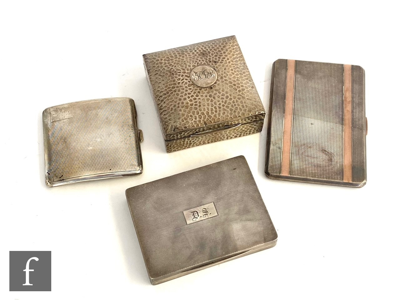 Three hallmarked silver cigarette cases each with engine turned decoration, total weight 16.5oz,