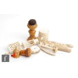 Eleven assorted bone and vegetable ivory sewing related items to include two clamps, two pin