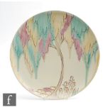 A 1930s Carlton Ware Handcraft charger decorated in the Tubelined Tree pattern with a stylised pink,