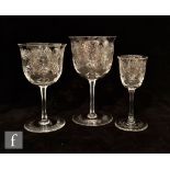 A 20th Century wine glass, the ovoid bowl above a facet cut stem raised to a circular spread foot,