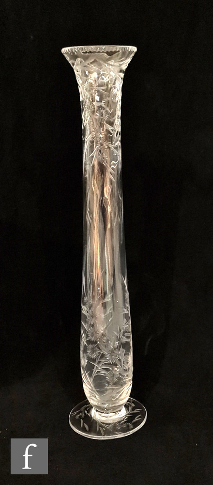 A late 19th Century Stevens and Williams clear crystal vase of footed slender form with optic