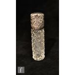 A late 19th Century hallmarked silver and cut glass scent bottle of cylindrical form, clear cut