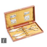 A cased hallmarked silver sewing set comprising silver handled button hook, bodkin, stiletto and