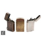 An early brass military lighter engraved with a flaming grenade, a Thorens plated lighter and a