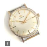 A gentleman's 9ct Marvin manual wrist watch, batons to a circular silvered dial, case diameter 34mm,