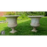 A pair of white marble campana terrace urns in the Regency style, each with a flared rim over a