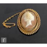 A 19th Century 18ct mounted oval cameo brooch, raised profile of a classical maiden within shot