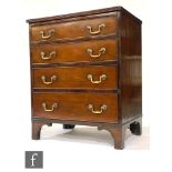 A small George III style mahogany chest of four graduated drawers, brass swan neck drop handles