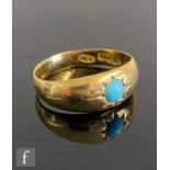 A late 20th Century 18ct single stone turquoise ring, gypsy set stone to plain shank,