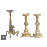 A continental 19th Century or earlier brass stand, the pierced dished support over a twist