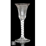 An 18th Century wine glass circa 1765, the trumpet bowl above a double series opaque twist stem with