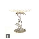 A Victorian silver plated table centre piece study of a standing giraffe below a palm tree