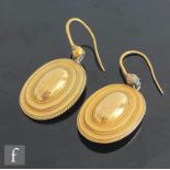 A pair of 19th Century 18ct stepped oval earrings terminating in shepherd's crook fittings, total