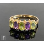 A 9ct hallmarked amethyst and peridot five stone ring, alternating stones with shot detail, all to