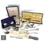 A parcel lot of hallmarked silver and other items to include napkin rings, cases tea spoons, four