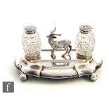 A Victorian silver plated oval desk stand with central study of a standing stag flanked by twin