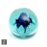 A 19th Century North Counties dump paperweight of spherical form, internally decorated with a blue