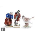 A pair of late 19th to early 20th Century Volkstedt Rudolstadt figures of beggars, she hunched