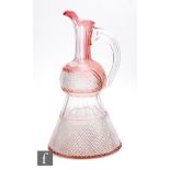 A late 19th Century Stevens and Williams glass carafe of thistle form with applied loop handle,
