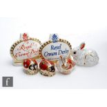 Six boxed Royal Crown Derby paperweights comprising two Crown name stands (one Members Only), two