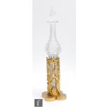 A late 19th Century Gothic cologne bottle and stand, circa 1870, the spire form clear crystal bottle