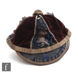 An early football cap in claret and blue embroidered with the dates 1904-5-6-7-8-9, and a rampant