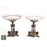 A near pair of 19th Century silver plated and cut glass comports, circular bases raised on three paw