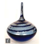 A large contemporary ceramic vase of compressed globe and shaft form with a tall slender neck,