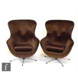 A pair of early 1970s Vono 'egg' style armchairs, upholstered in brown velour or dralon over