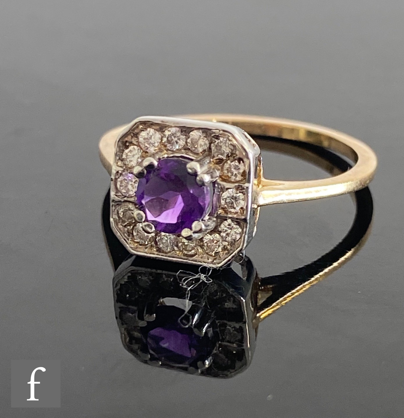 A 9ct hallmarked amethyst and diamond cluster ring, central claw set amethyst to a pave diamond