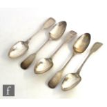 A set of five hallmarked silver fiddle and rat tail pattern table spoons each with engraved single