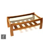 A G-Plan 'Katrina' teak coffee table of rectangular form with an inset smoked glass top, with