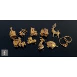 Ten assorted 9ct charms to include a stag, a turtle and a church, total weight 32g. (10)