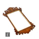 A 20th Century George III style fret carved wall mirror, 89cm x 51cm.