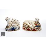 Two boxed Royal Crown Derby paperweights comprising Leopard Cub and Lion Cub, both with gold