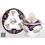 A small 19th Century Chamberlain Worcester tureen and stand decorated in the Two Quails pattern with