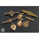 Four assorted 9ct bar brooches with four assorted 9ct pendants to include a heart shaped locket