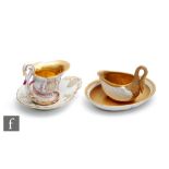A Dresden oval cup and saucer, the cup formed as a swan with a curling neck forming the handle,