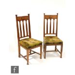 A set of six Arts and Crafts oak dining chairs by Chamberlain, King and Jones of Birmingham, the top