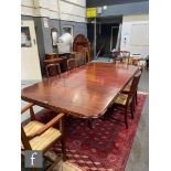 A Victorian mahogany extending dining table, the double moulded edge top over a plain frieze on