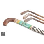 A 1968 Olympic hockey stick made by R K Mahajan & Co for A.W.Phillips Ltd, length 91cm, and three