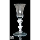 An 18th Century wine glass circa 1770, the bell bowl above a double series opaque twist stem with an